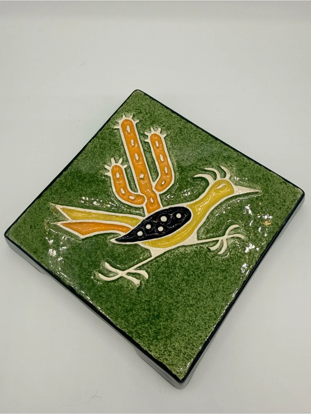 Vintage Legendware handcrafted ceramic roadrunner and cactus trivet.